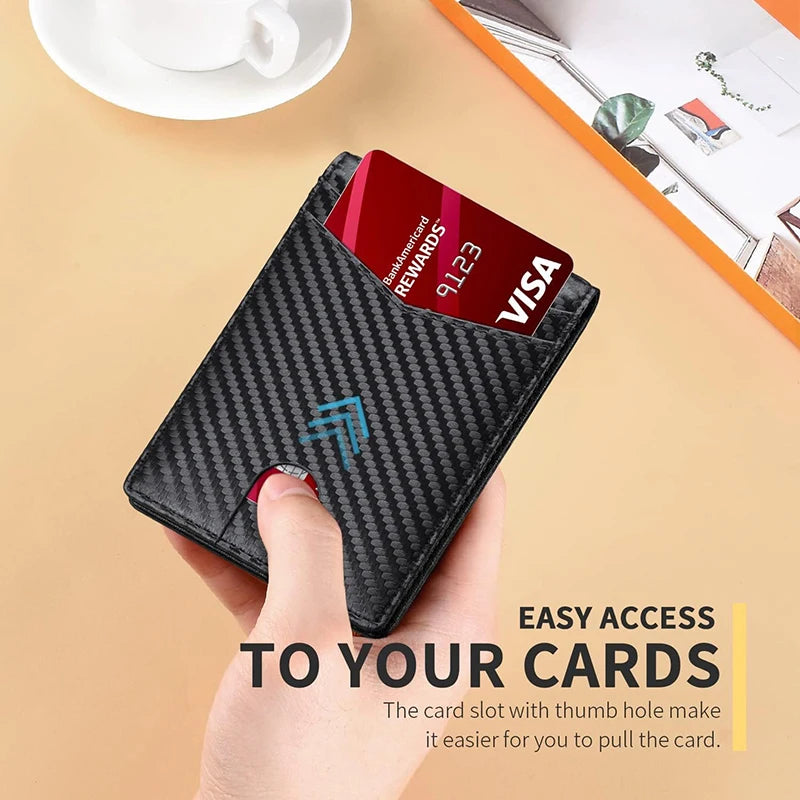 Black carbon fiber wallet with card slot held by a hand, with a Visa card inside on a beige surface.