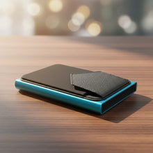 Load image into Gallery viewer, Blue  Ozerlo Men_Women_Luxury_Wallet on a wooden surface with blurred lights in the background