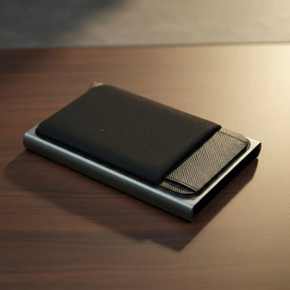 Black wallet with mesh pocket on a wooden surface
