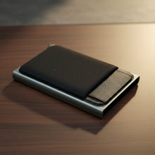 Load image into Gallery viewer, Black wallet with mesh pocket on a wooden surface