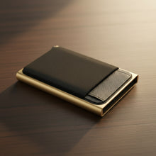 Load image into Gallery viewer, Black cardholder with gold frame on a white background